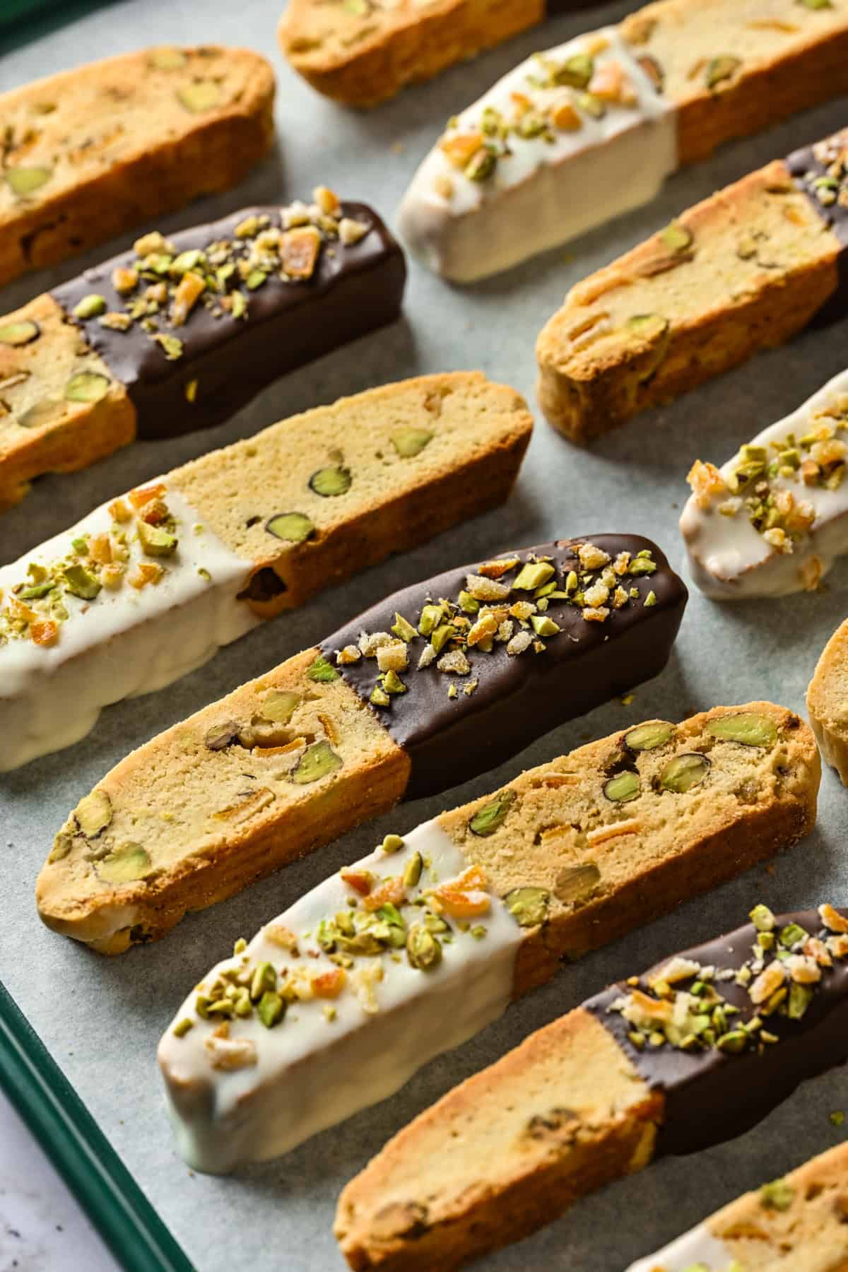 Overhead view of biscotti set atop a sheet pan.