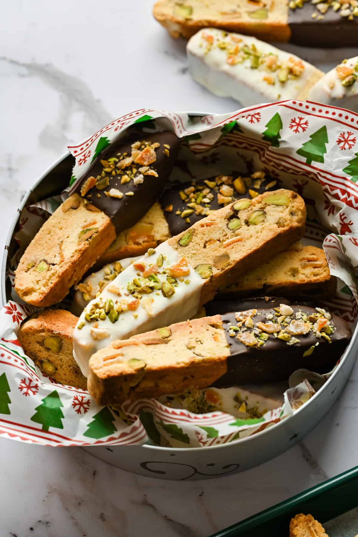 Overhead view of biscotti in a tin.