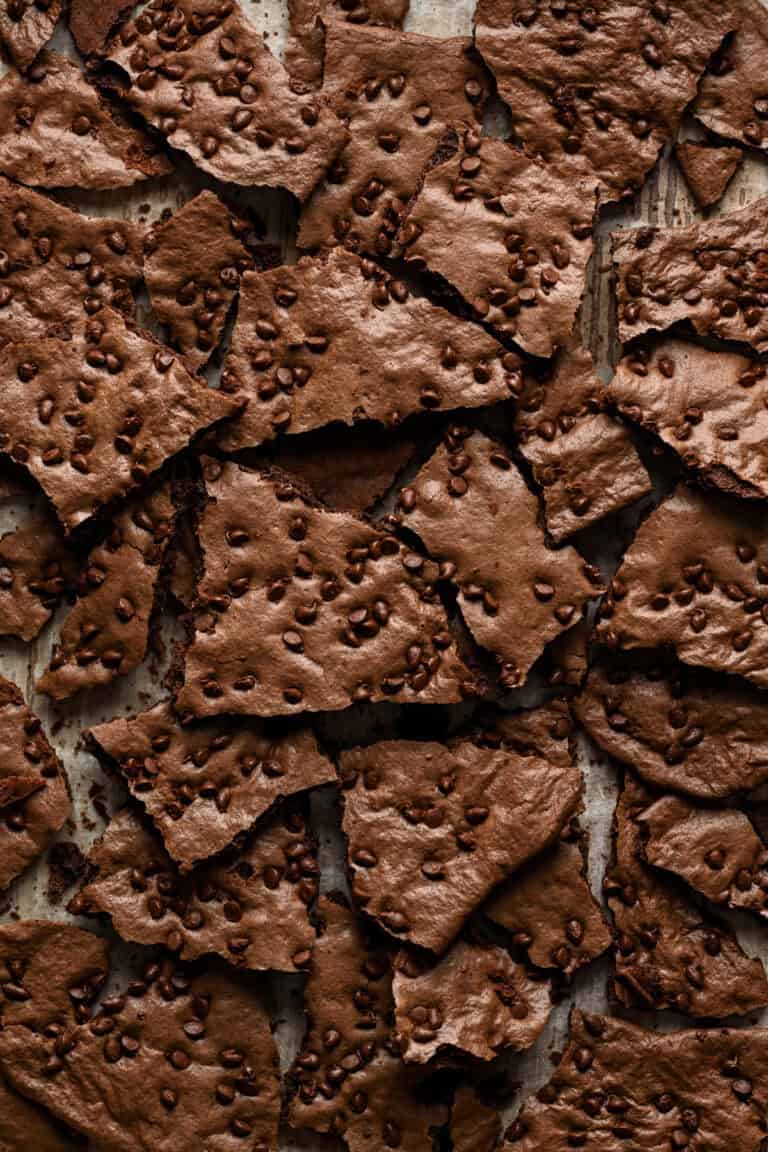 Overhead view of brownie brittle broken up into pieces.