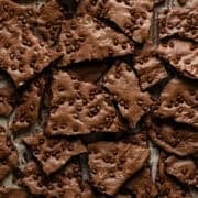 Overhead view of brownie brittle broken up into pieces.