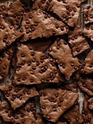 Overhead view of brownie brittle broken up into pieces.