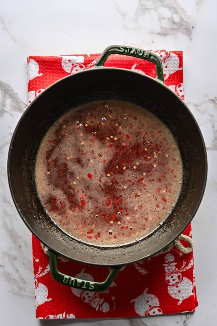 Overhead view of red pepper jelly after cooking.