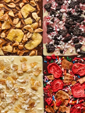Overhead view of four chocolate bars with varied toppings.