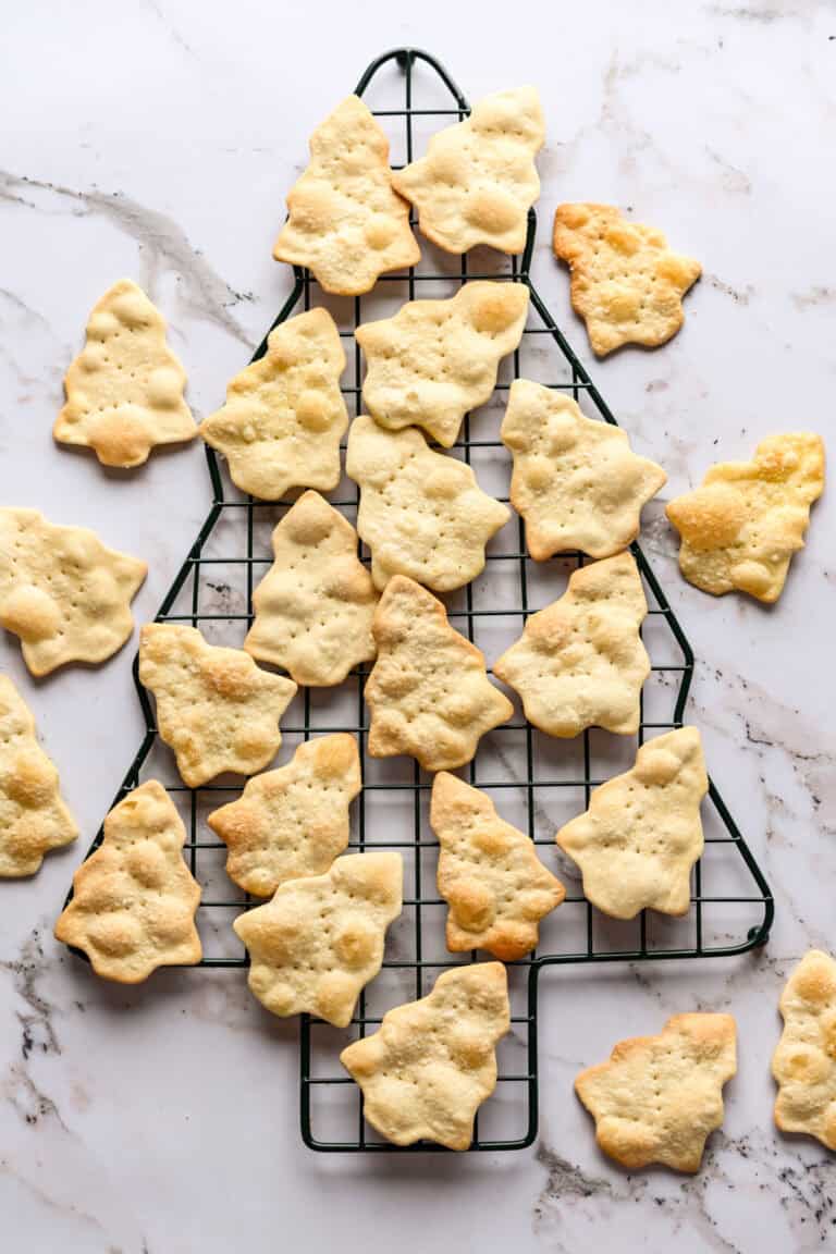 overhead view of christmas tree shaped crackers on christmas tree shaped cooling rack.