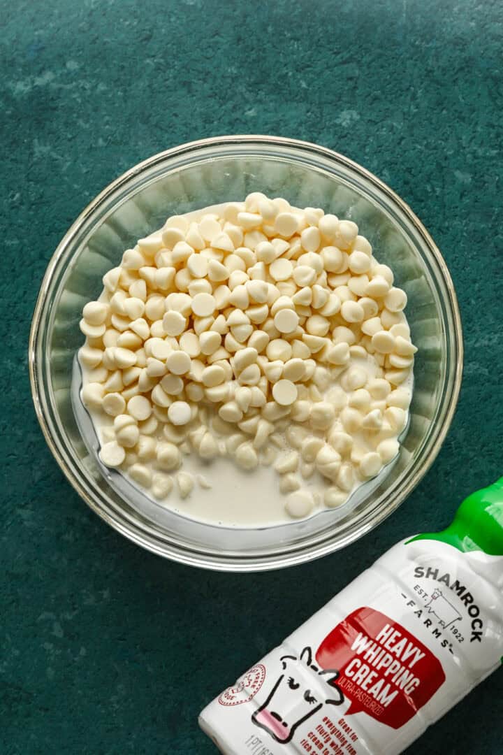 White chocolate and heavy cream in a bowl.
