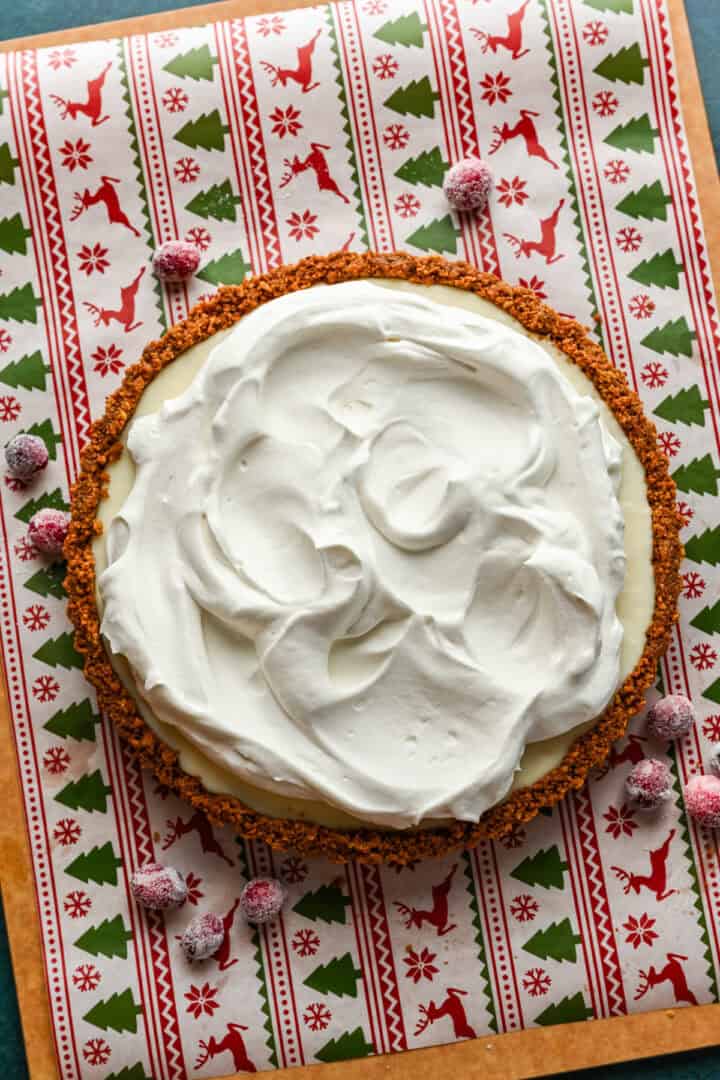 whipped cream on top of cranberry white chocolate tart.