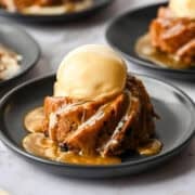Mini figgy pudding topped with ice cream and caramel sauce.