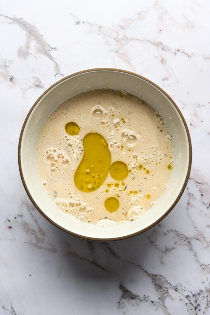 Wet ingredients and flour in a bowl.