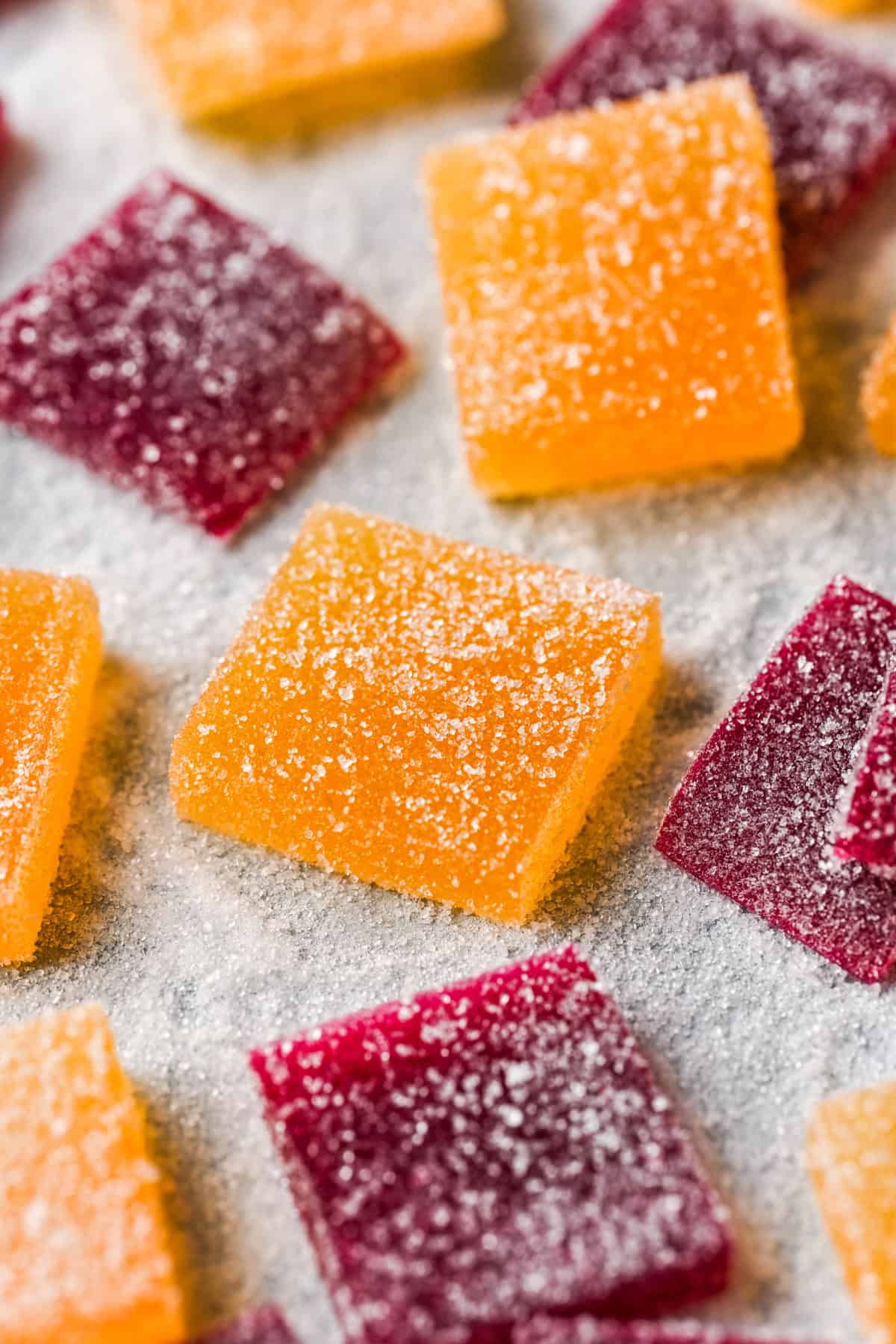 Front view of pate de fruit coated in sugar.