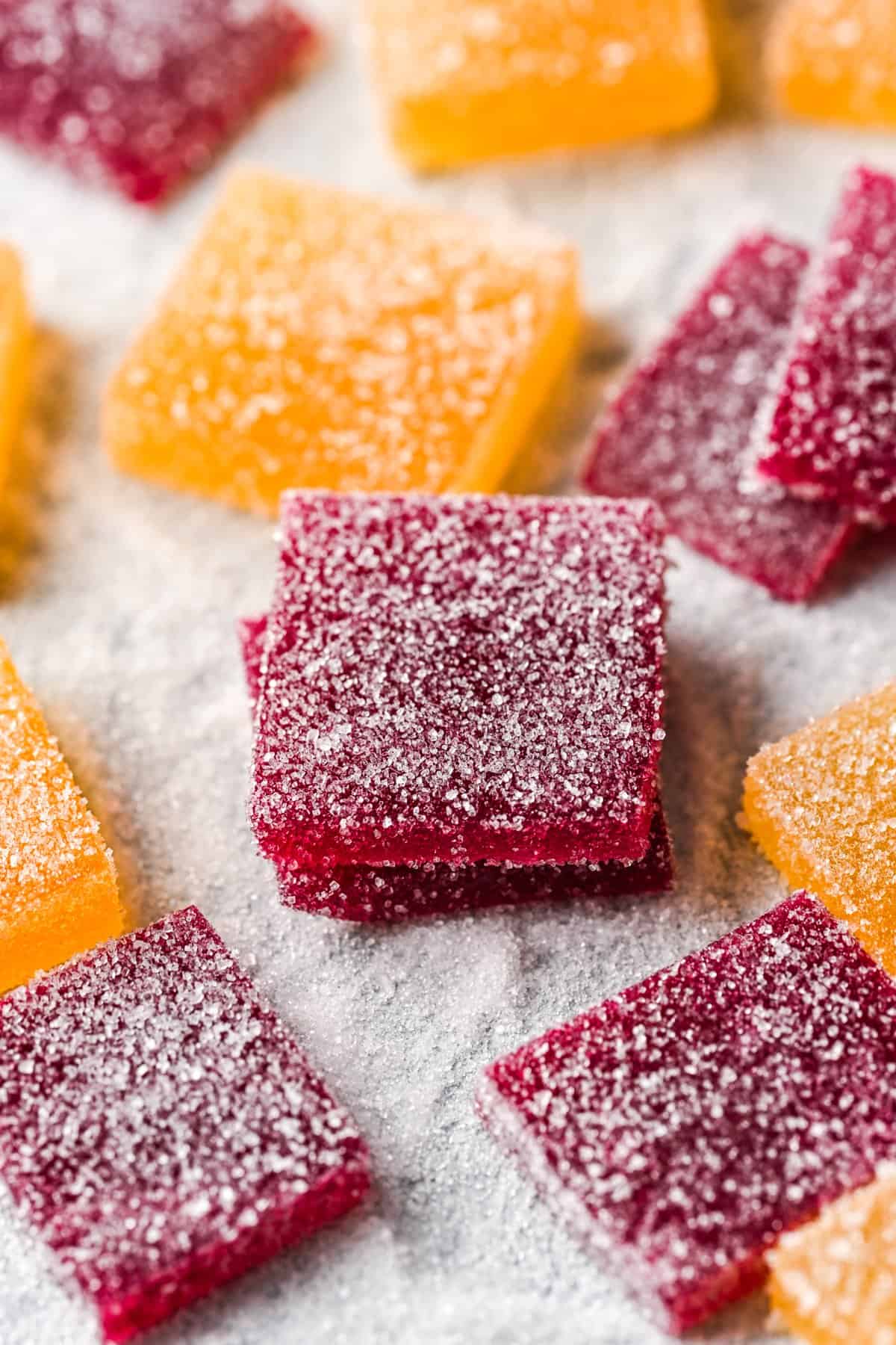 Front view of pate de fruit coated in sugar.