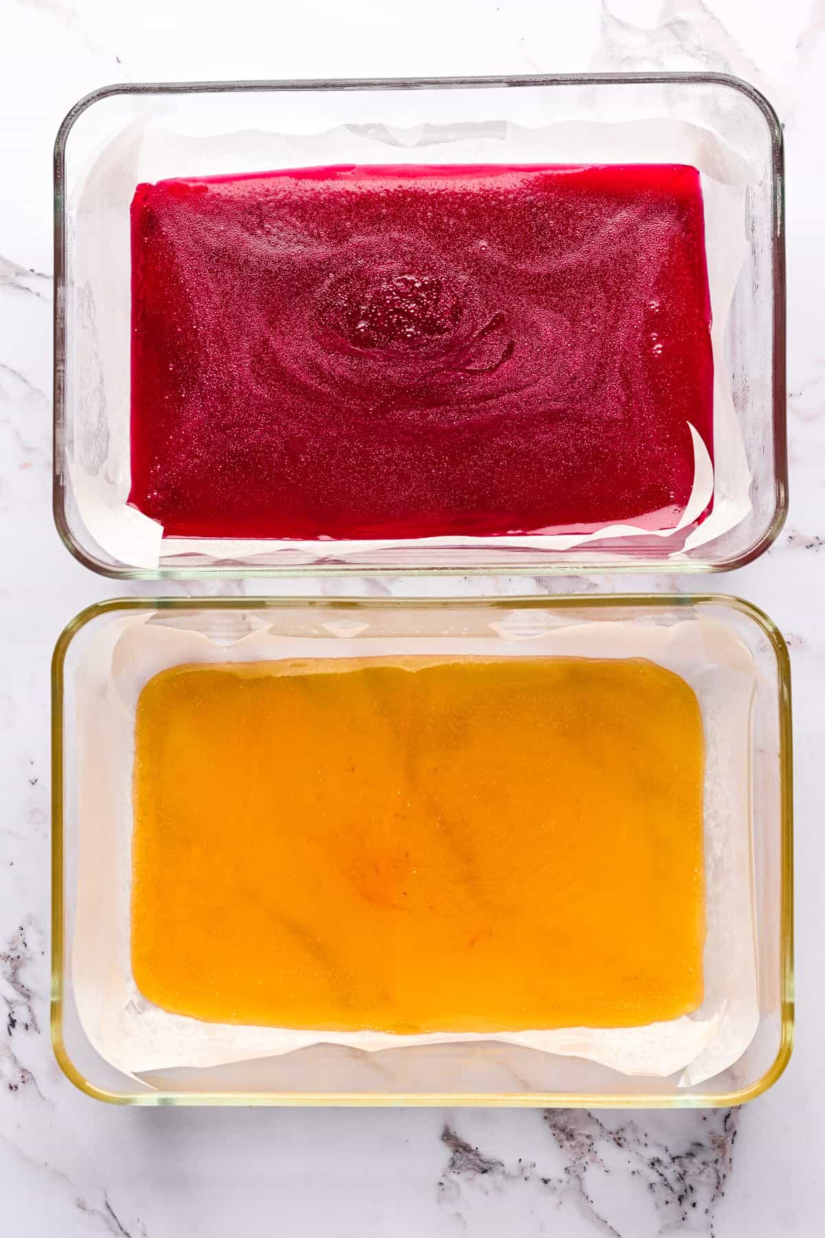 Pate de fruit poured into a glass container.