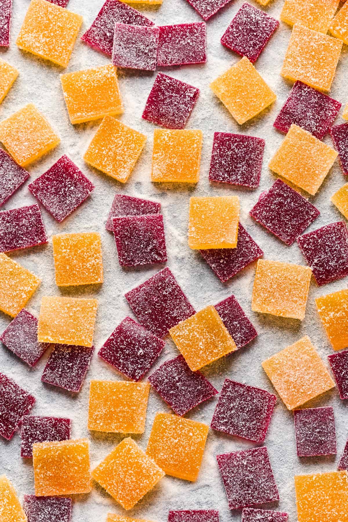 Overhead view of pate de fruit on a sheet pan.