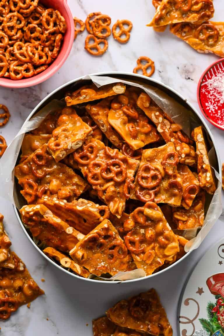 Pretzel peanut brittle in a cookie tin.