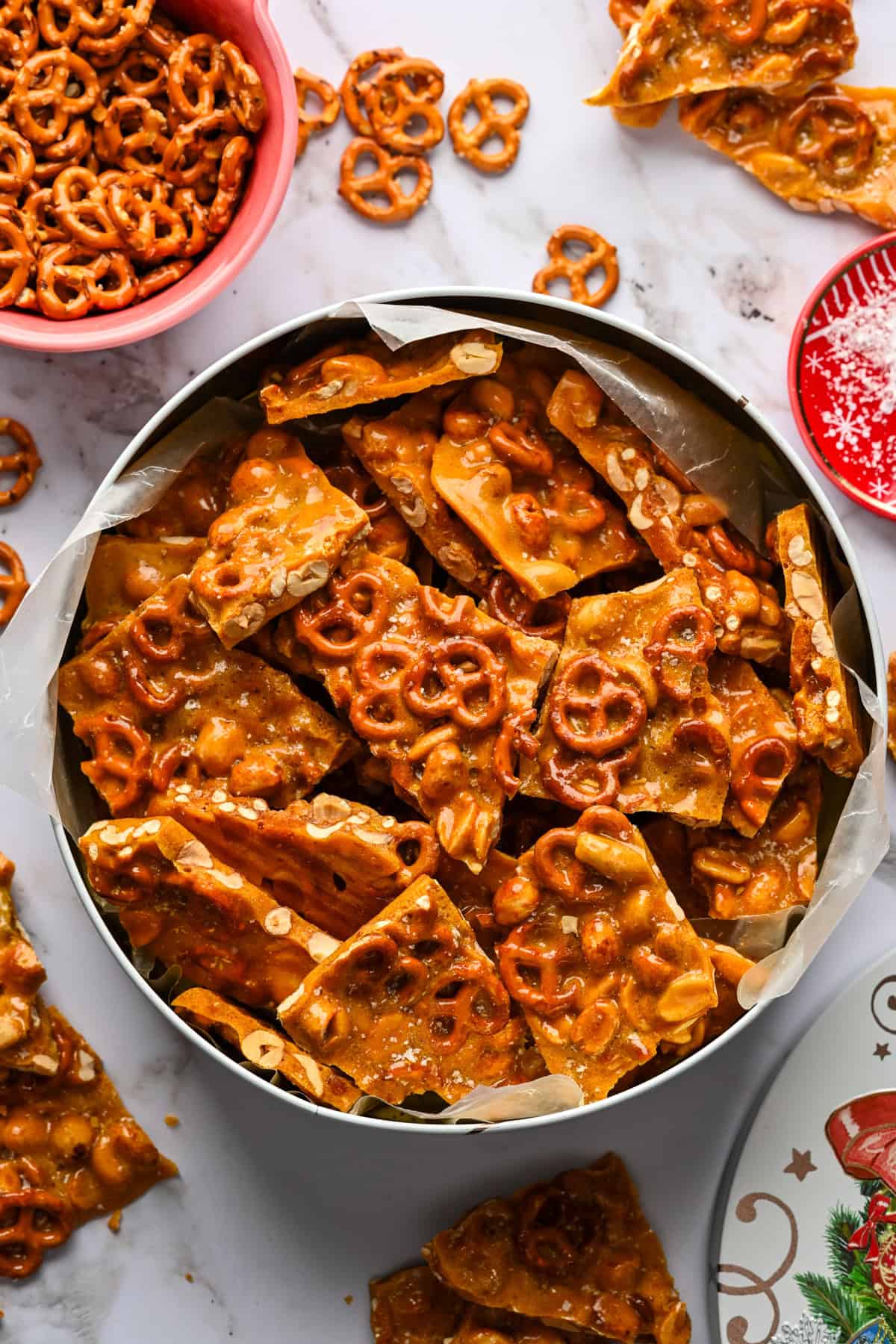 Pretzel peanut brittle in a cookie tin.
