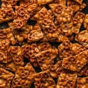 Close up overhead view of pretzel peanut brittle pieces.