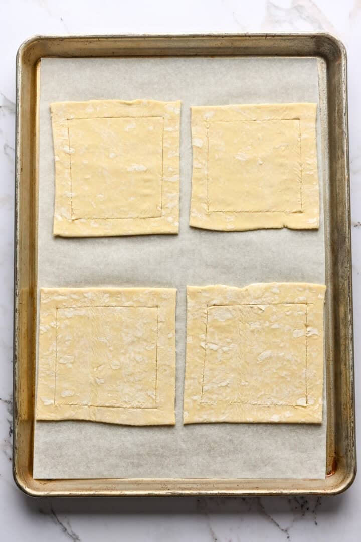 Overhead view of scored puff pastry.