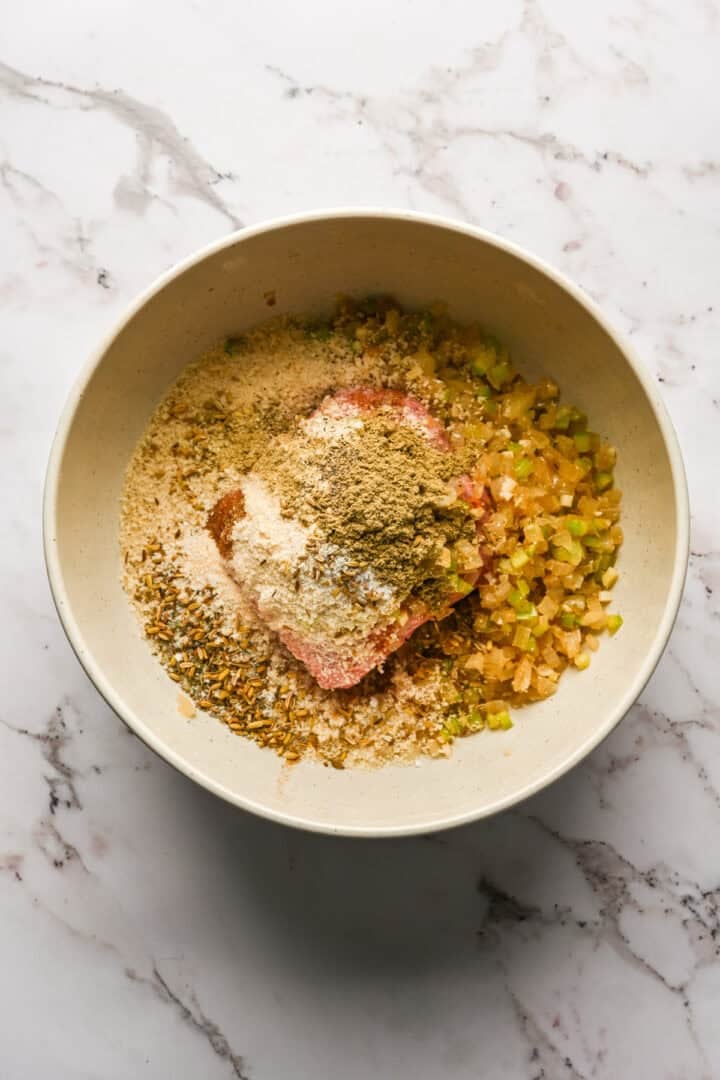 Sausage ingredients in a mixing bowl before mixing together.