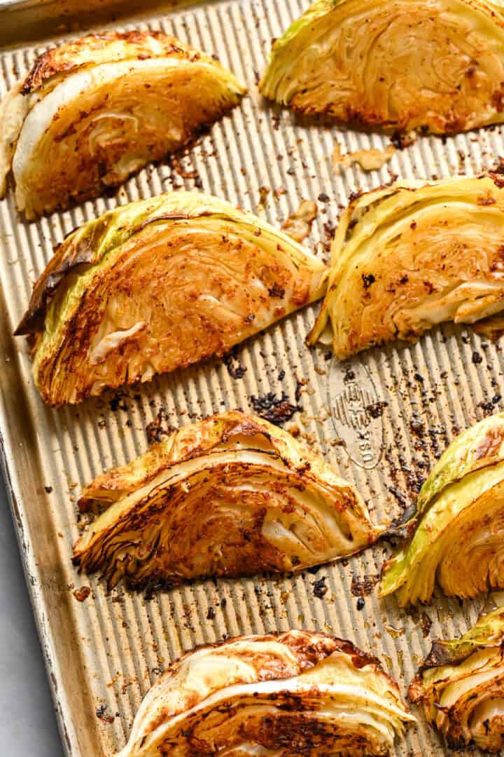 Overhead view of cabbage wedges after roasting.