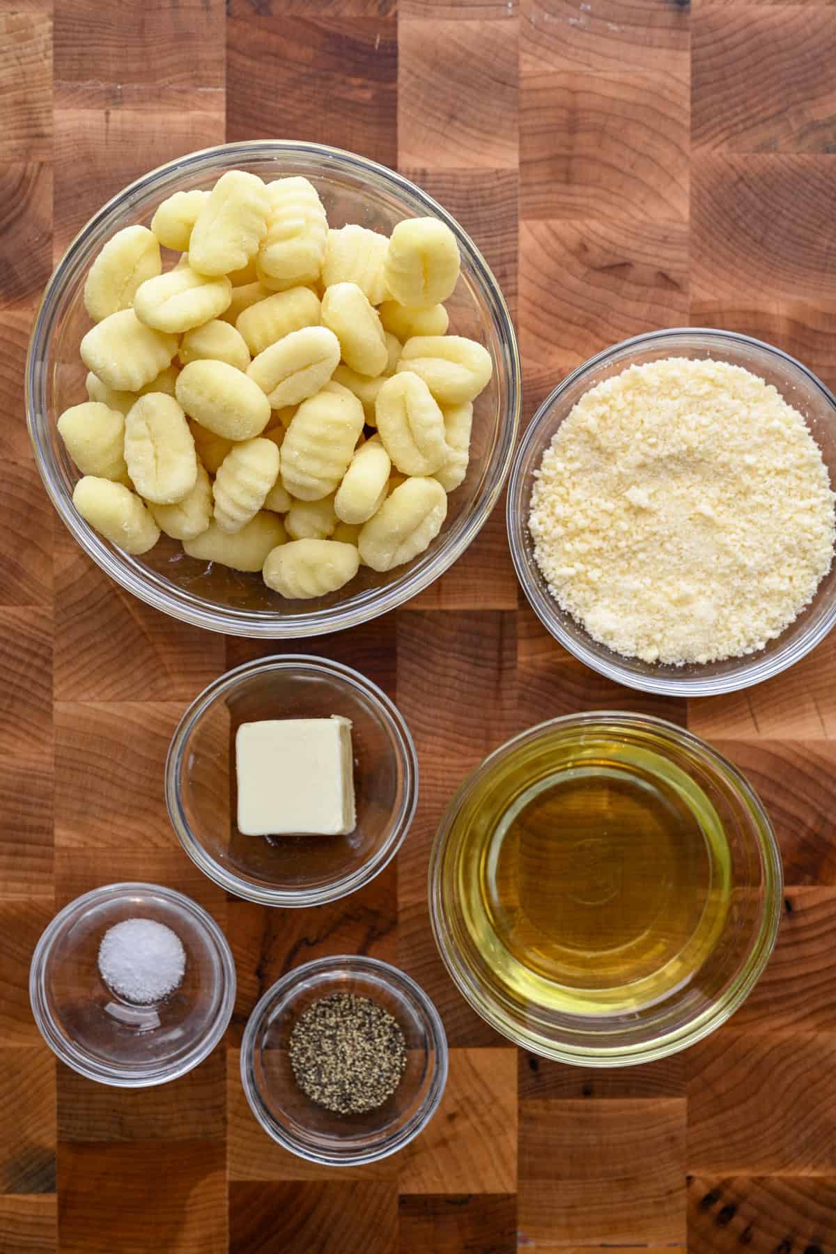 Overhead view of ingredients for air fryer gnocchi in separate bowls.