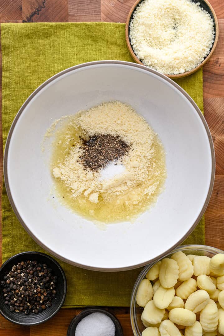Melted butter, olive oil, parmesan, salt and pepper before mixing together.