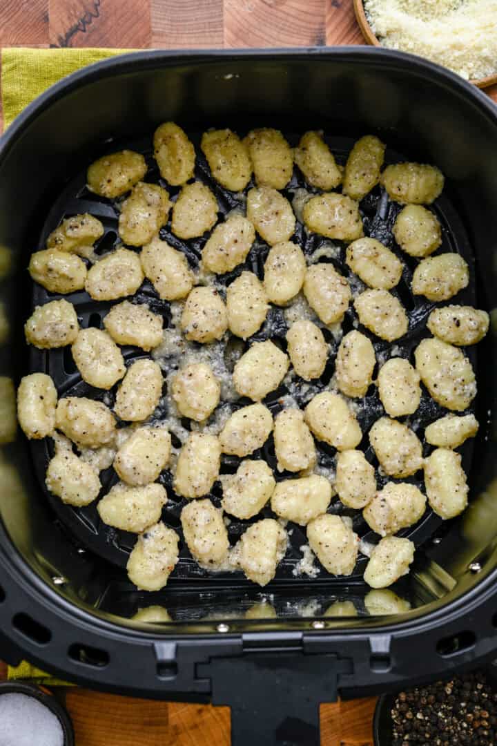 Gnocchi in the air fryer basket before cooking.