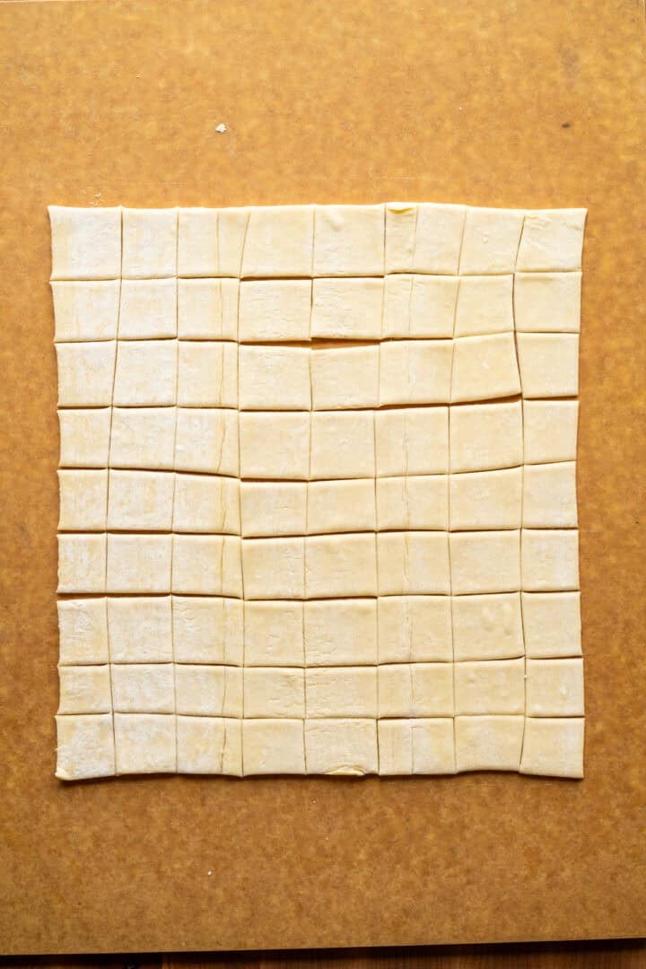 Puff pastry croutons cut into squares.