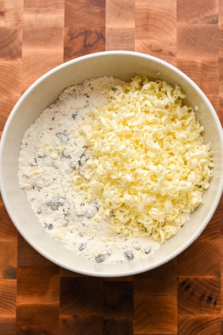 Grated butter on top of dry mixture for irish soda bread scones before mixing.