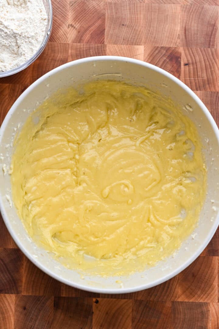 Wet ingredients for sugar cookie dough in a bowl.