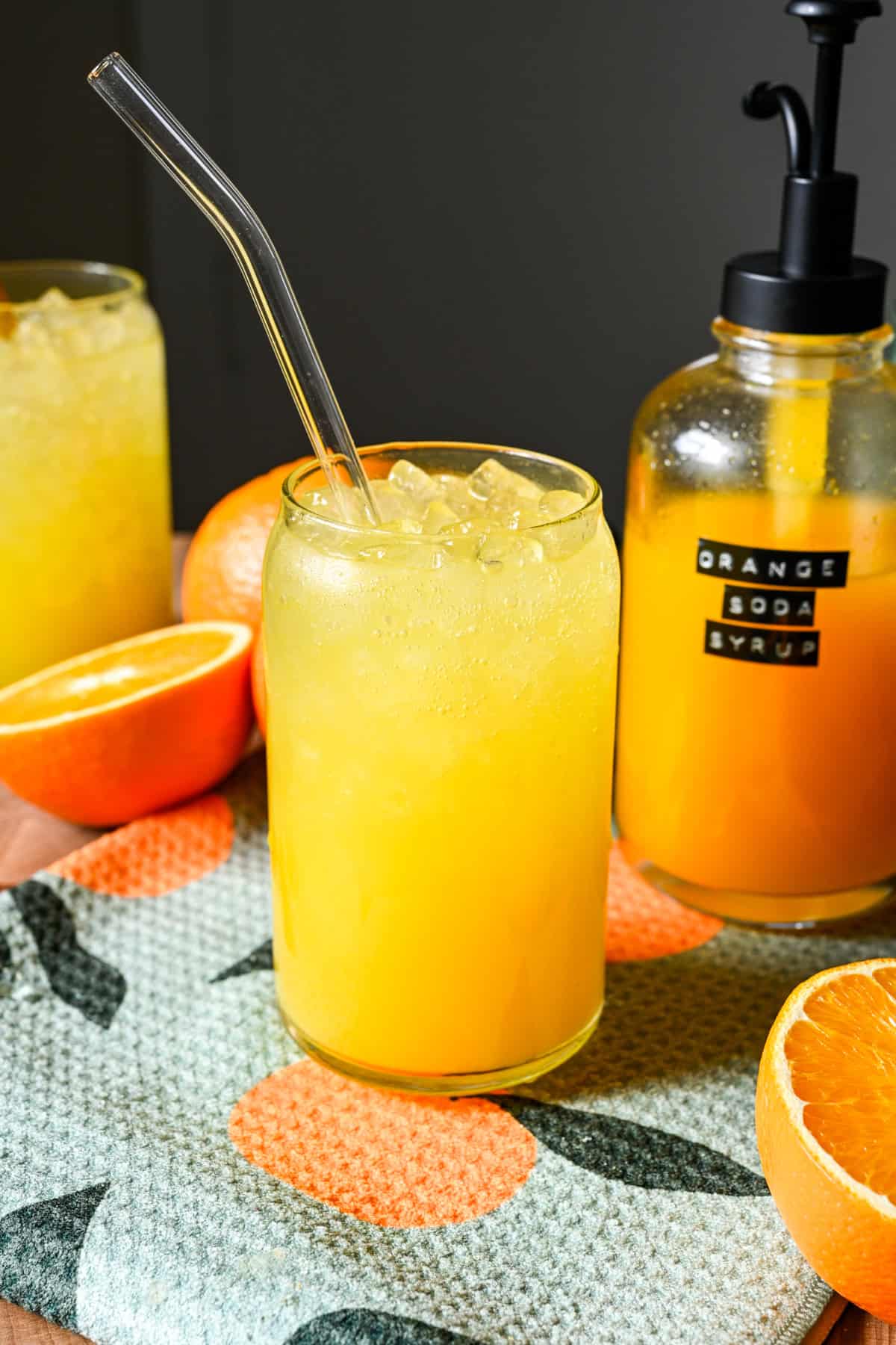 Front view of orange soda in a glass.