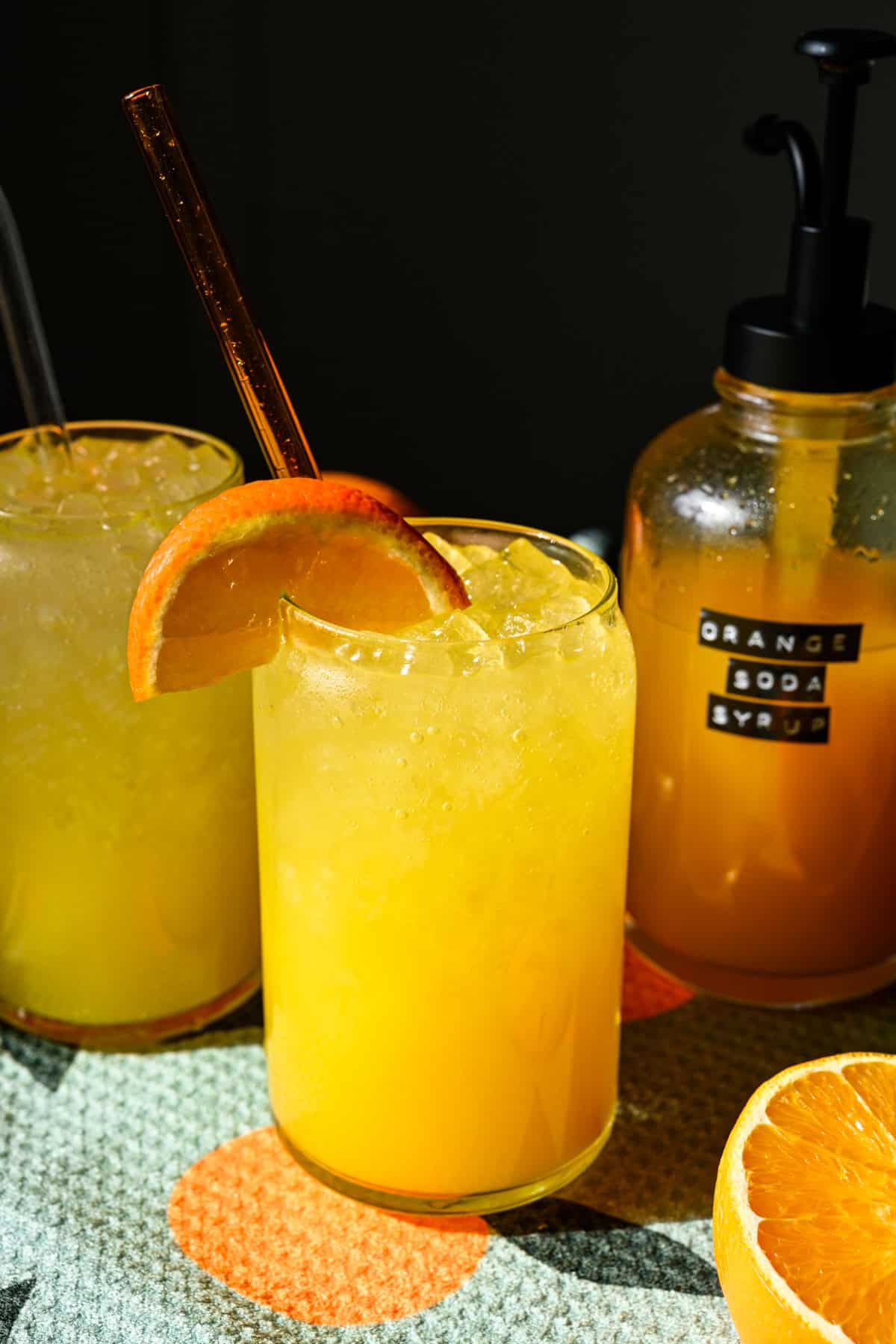 Front view of orange soda in a glass.