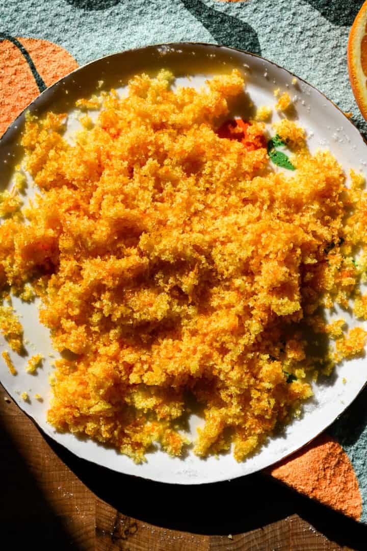 Orange zest after being mixed together with sugar.