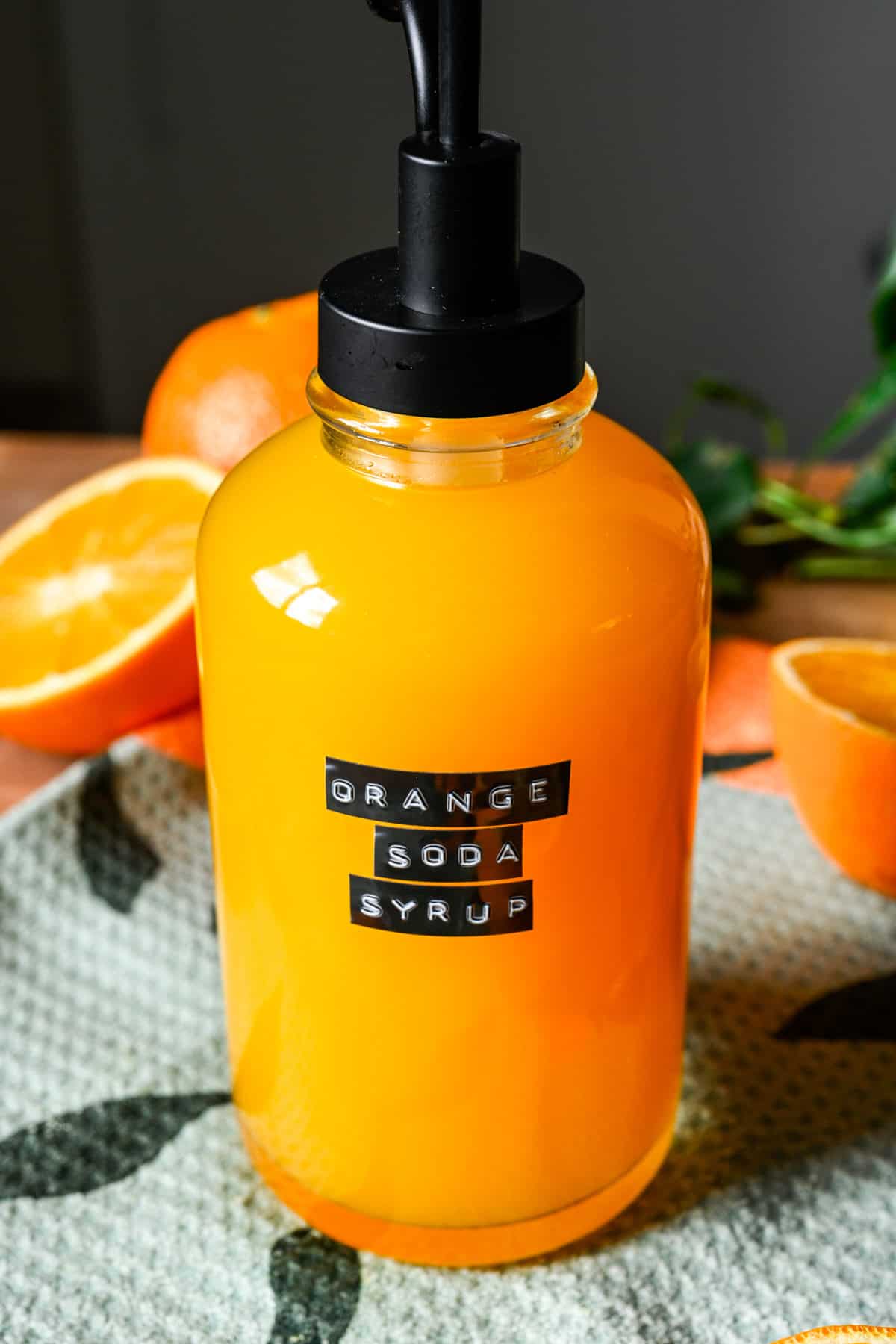 Orange soda syrup in a pump bottle.