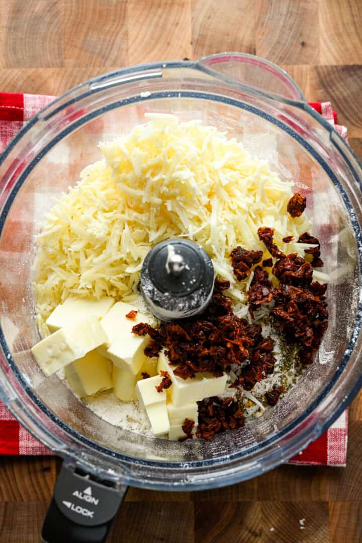 Overhead view of cheez it ingredients in a food processor.