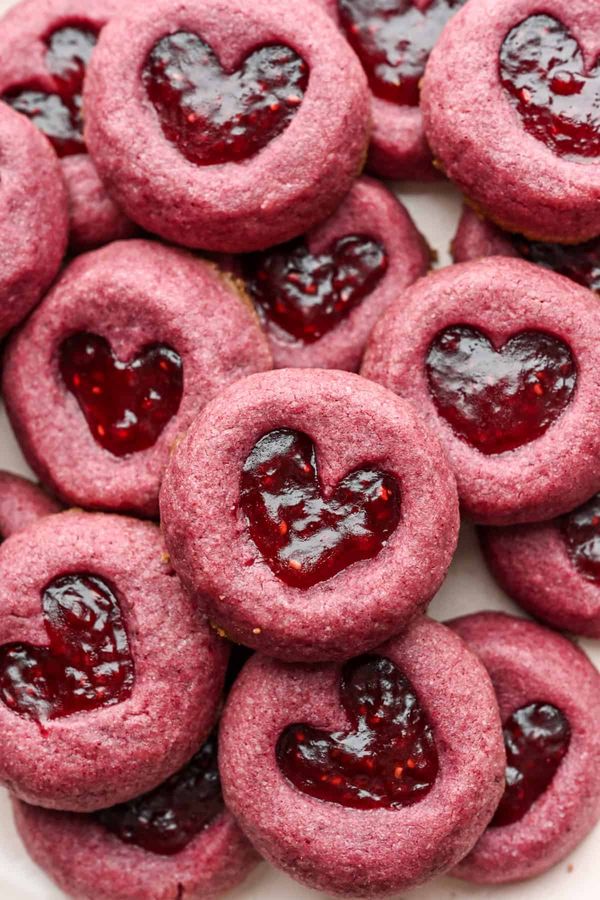 Close up view of Raspberry heart thumbprint cookies.