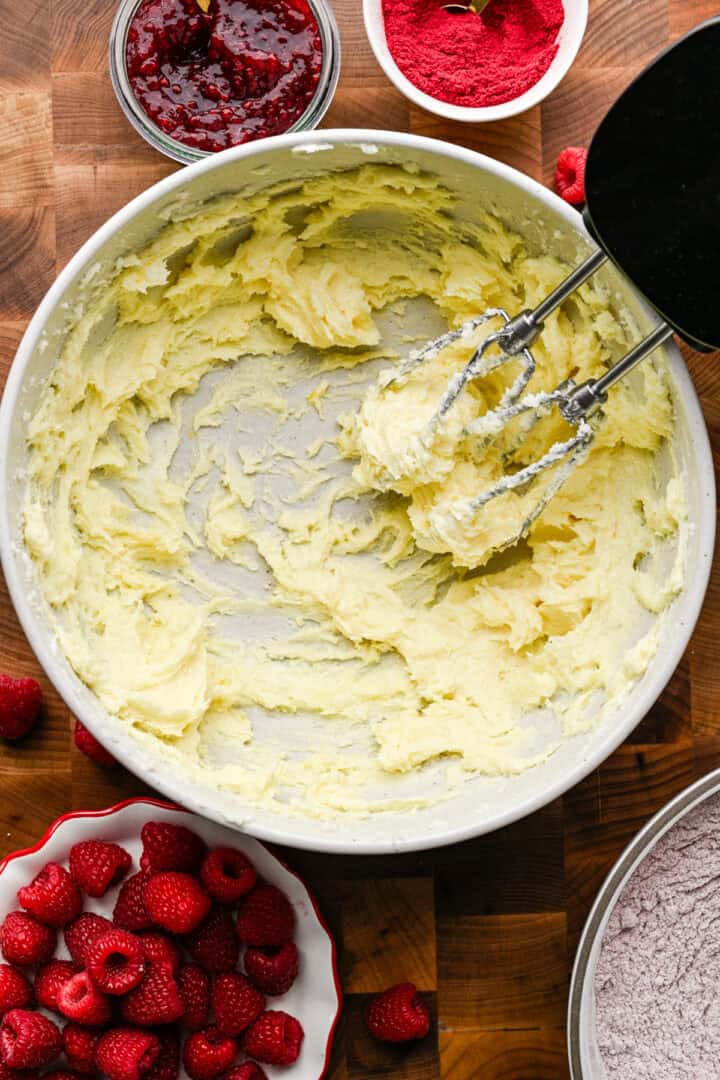 Butter, sugar and eggs creamed in a bowl.