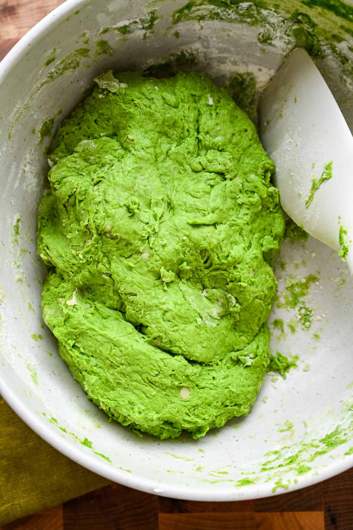Overhead view of dough in a bowl.