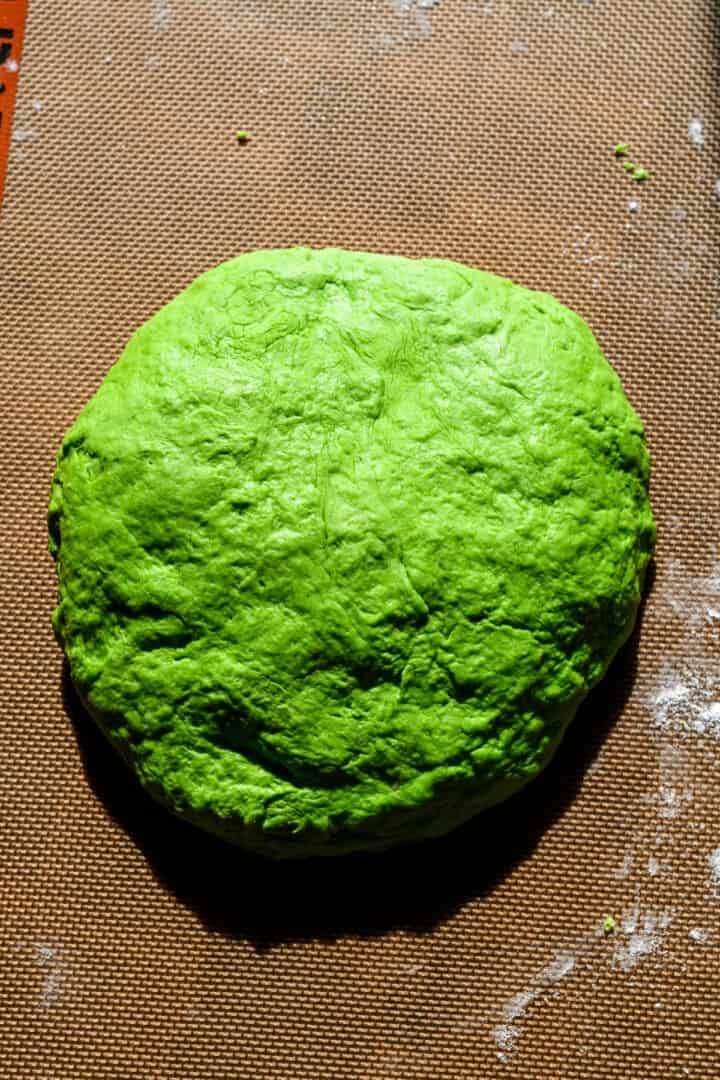 Overhead view of tortilla dough in one large ball.