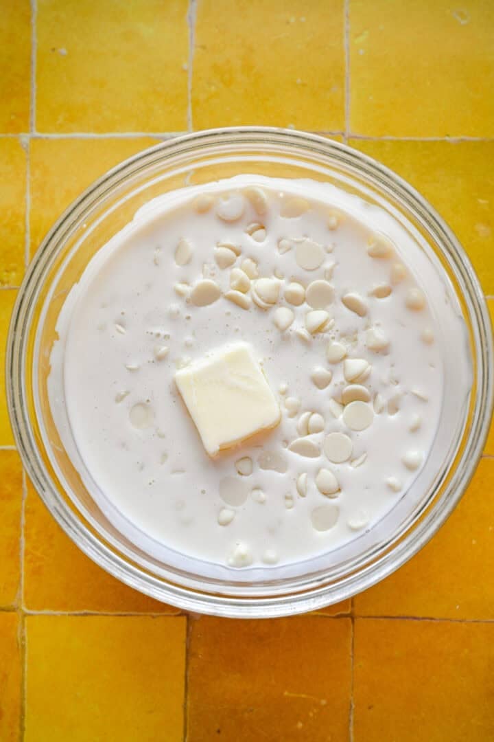 Overhead view of melted white chocolate in a bowl.