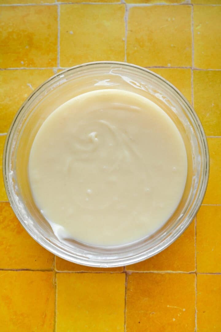 Melted white chocolate in a bowl.