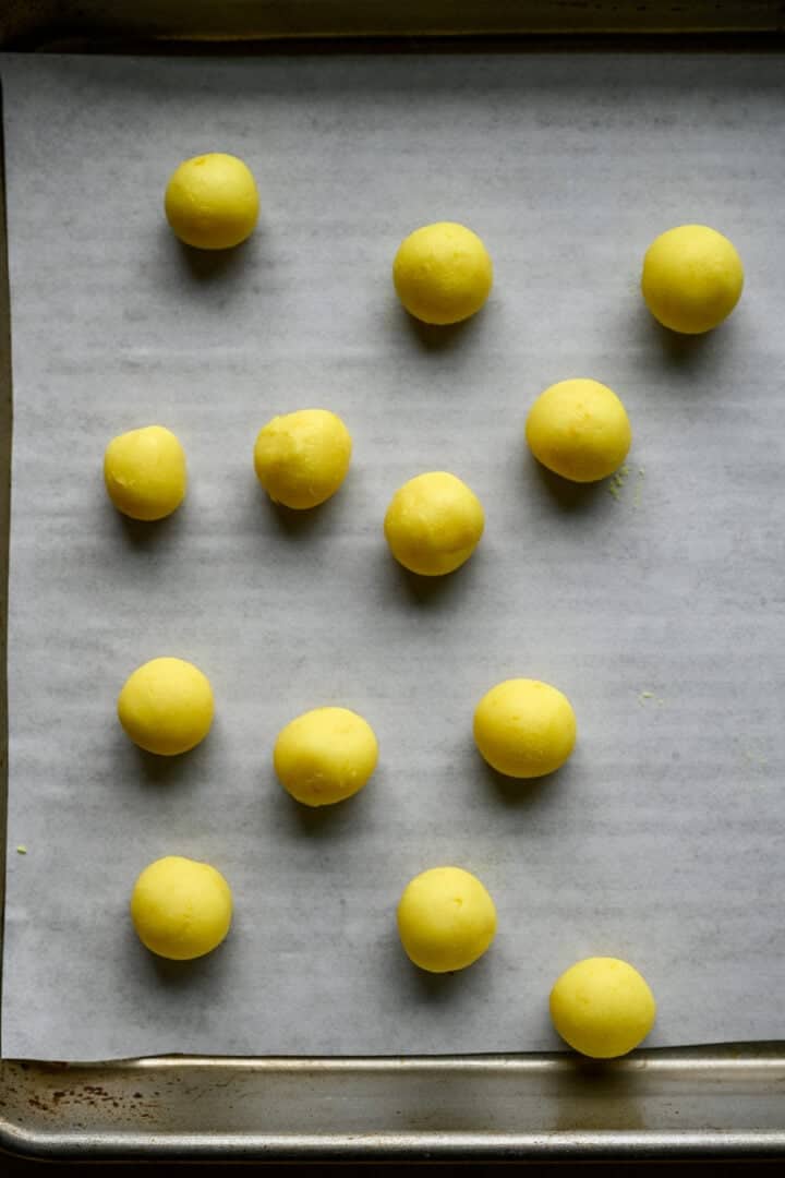 Several yellow centers on a sheet pan.