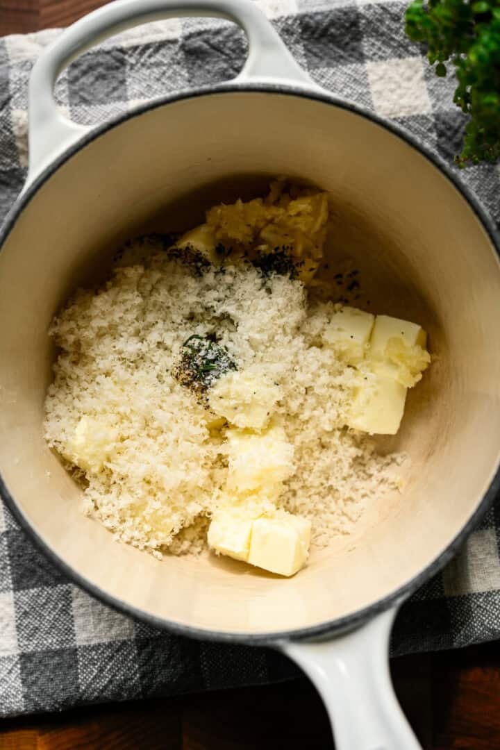 Overhead view of potato rose ingredients in a pot before melting.