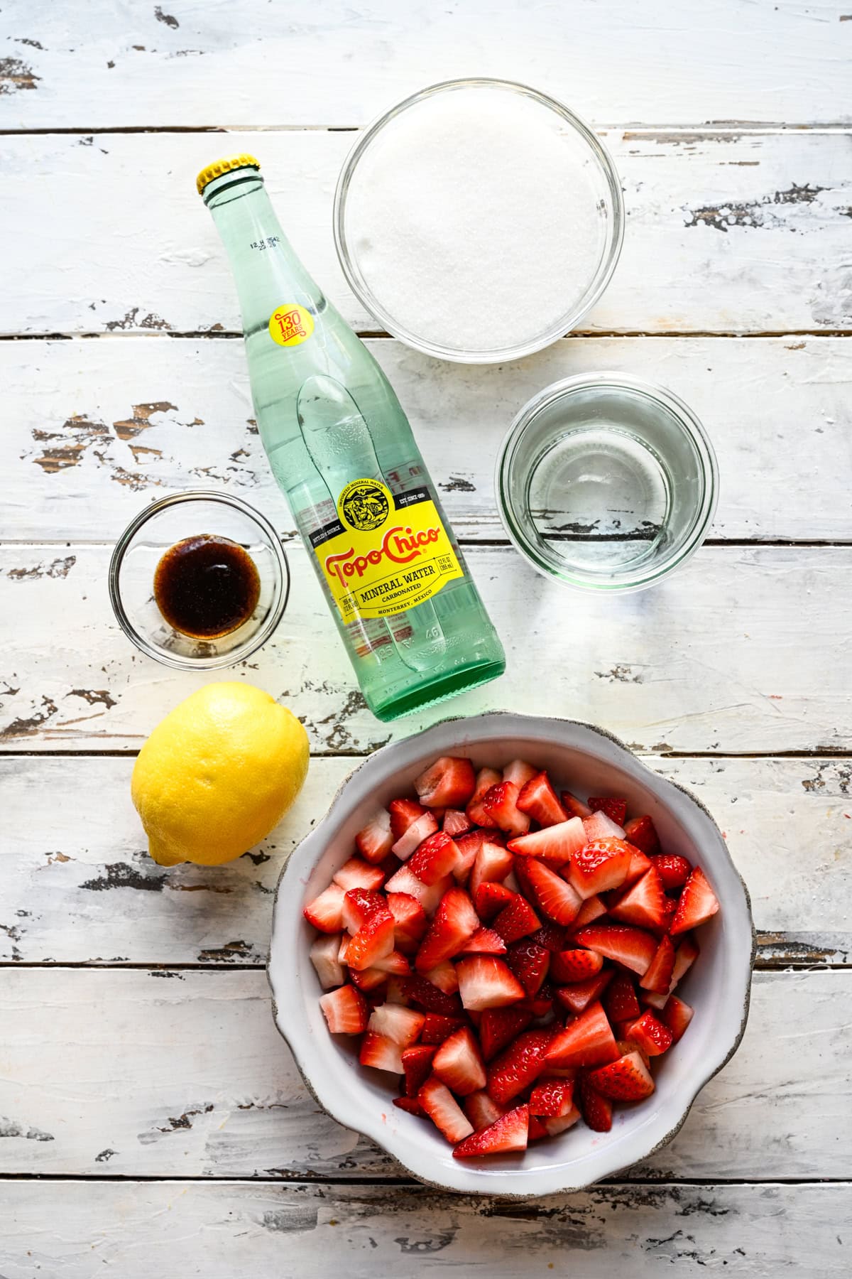 Overhead view of strawberry vanilla soda ingredients.