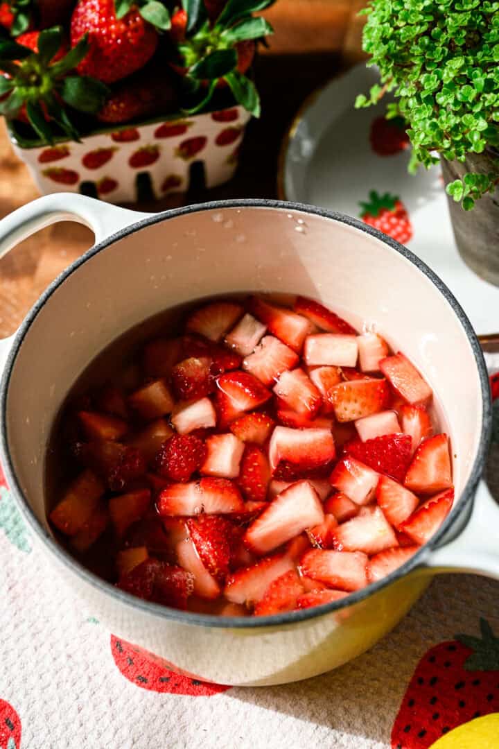 Strawberries in a pot before simmering.