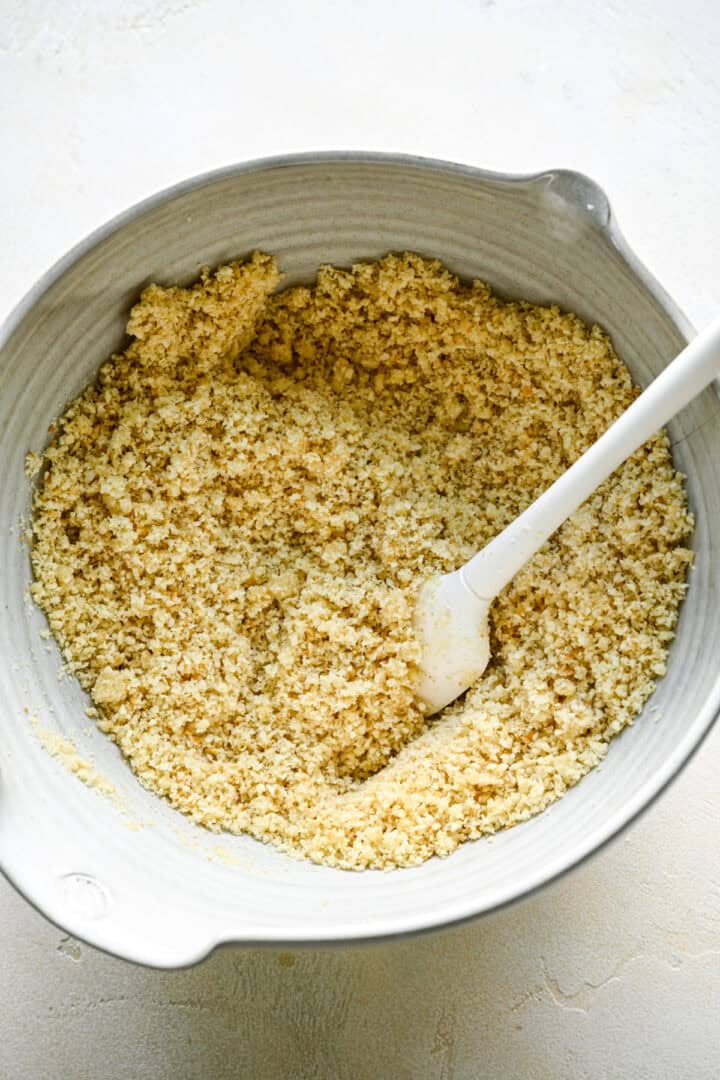 Saltine cracker crumbs mixed with melted butter and sugar.