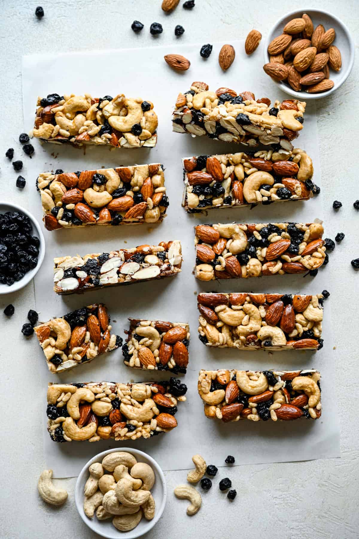 Overhead view of blueberry cashew KIND bar copycats on parchment paper.
