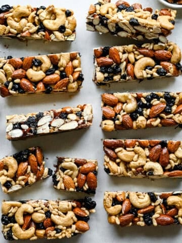 Overhead view of blueberry cashew KIND bar copycats on parchment paper.