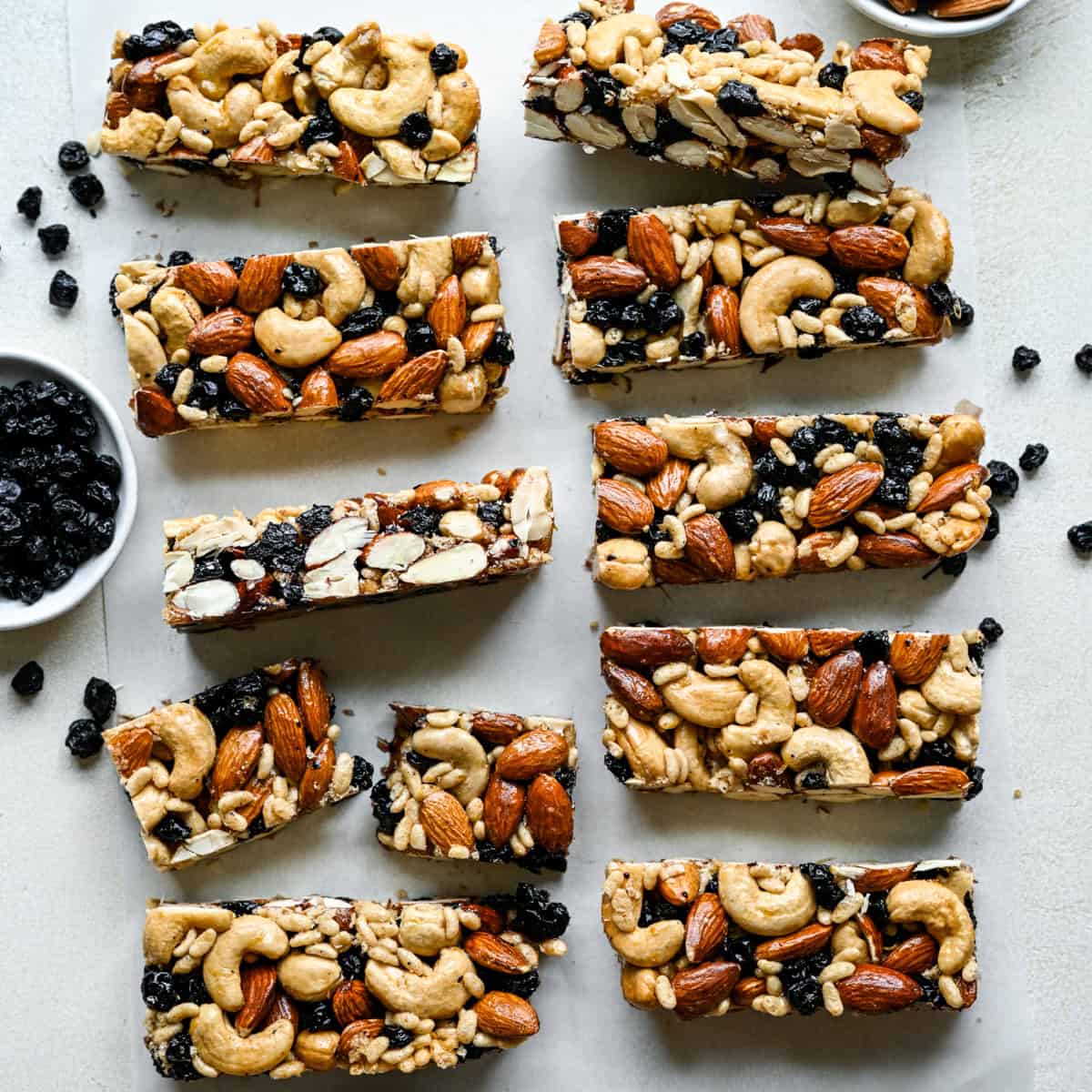 Overhead view of blueberry cashew KIND bar copycats on parchment paper.