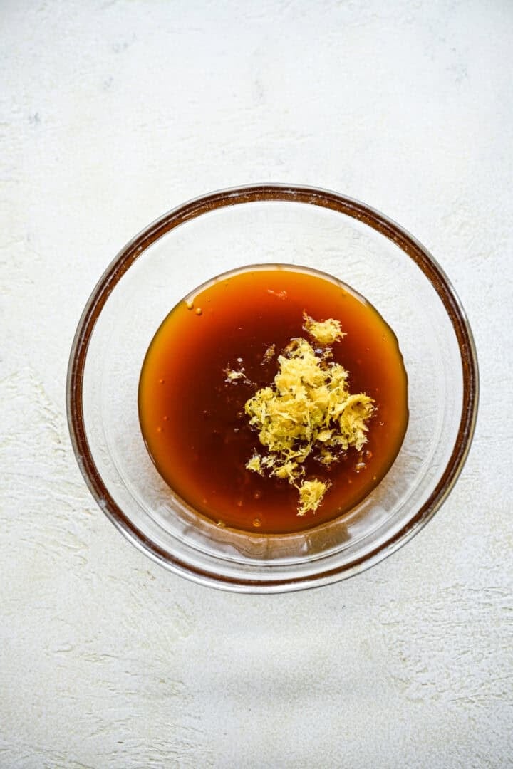 Brown rice syrup and lemon zest in a small bowl.
