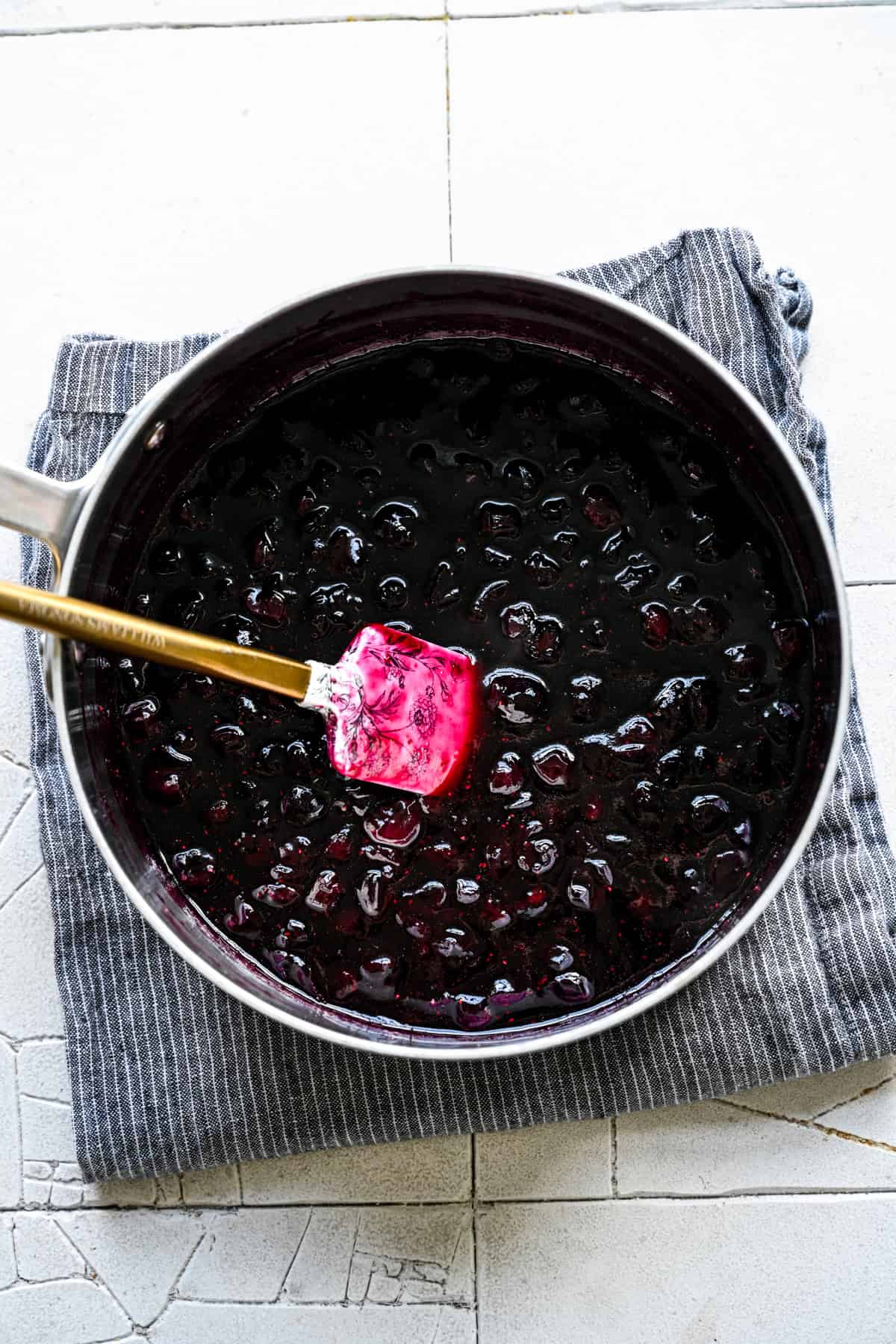 Blueberry mixture poured into a bowl to cool.