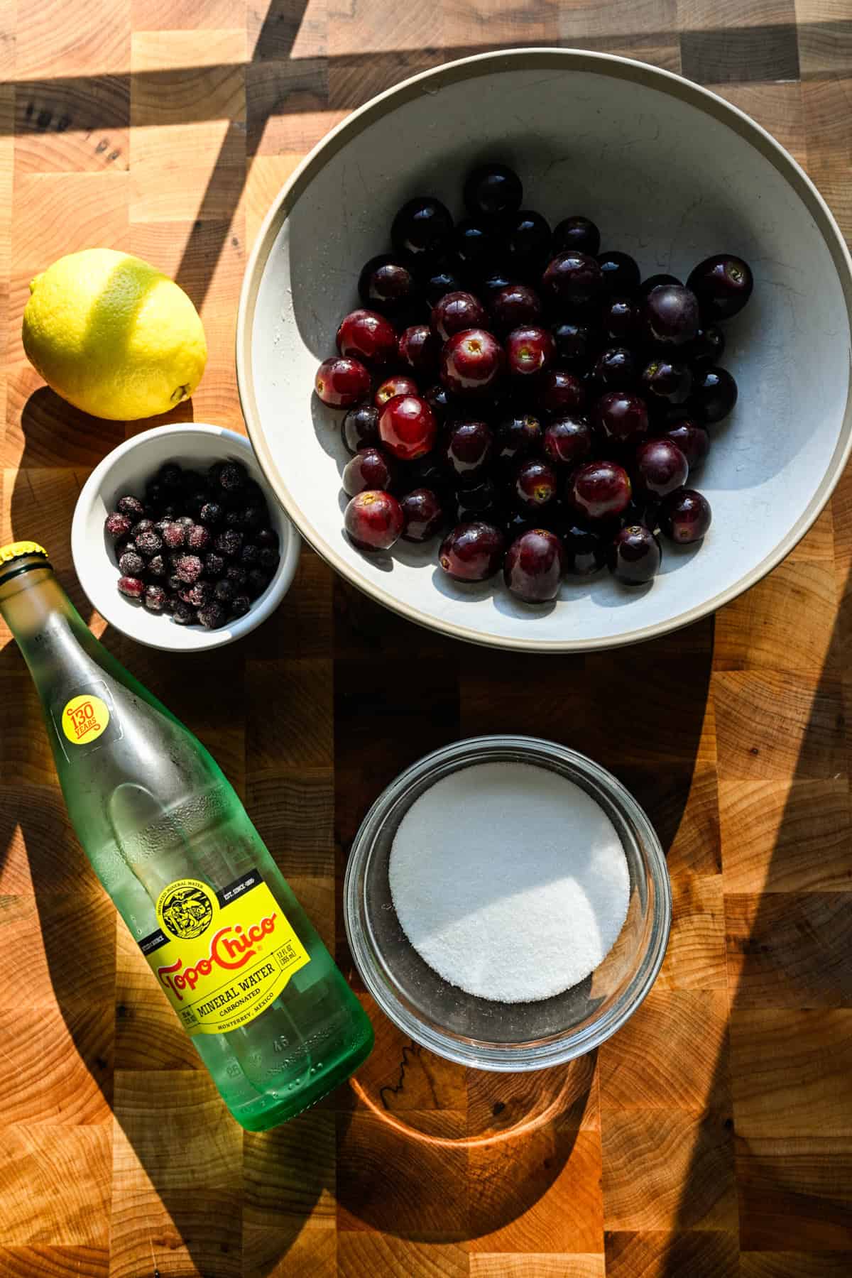Overhead view of ingredients for grape soda syrup.
